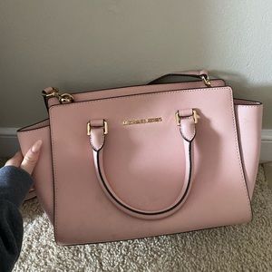 Light pink Michael Kors bag.